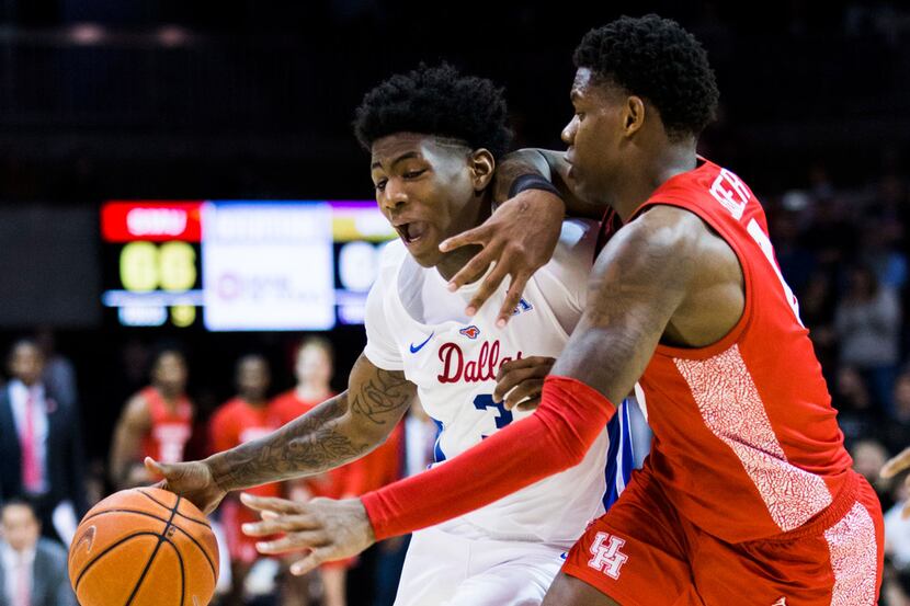 Southern Methodist Mustangs guard Kendric Davis (3) is defended by Houston Cougars guard...
