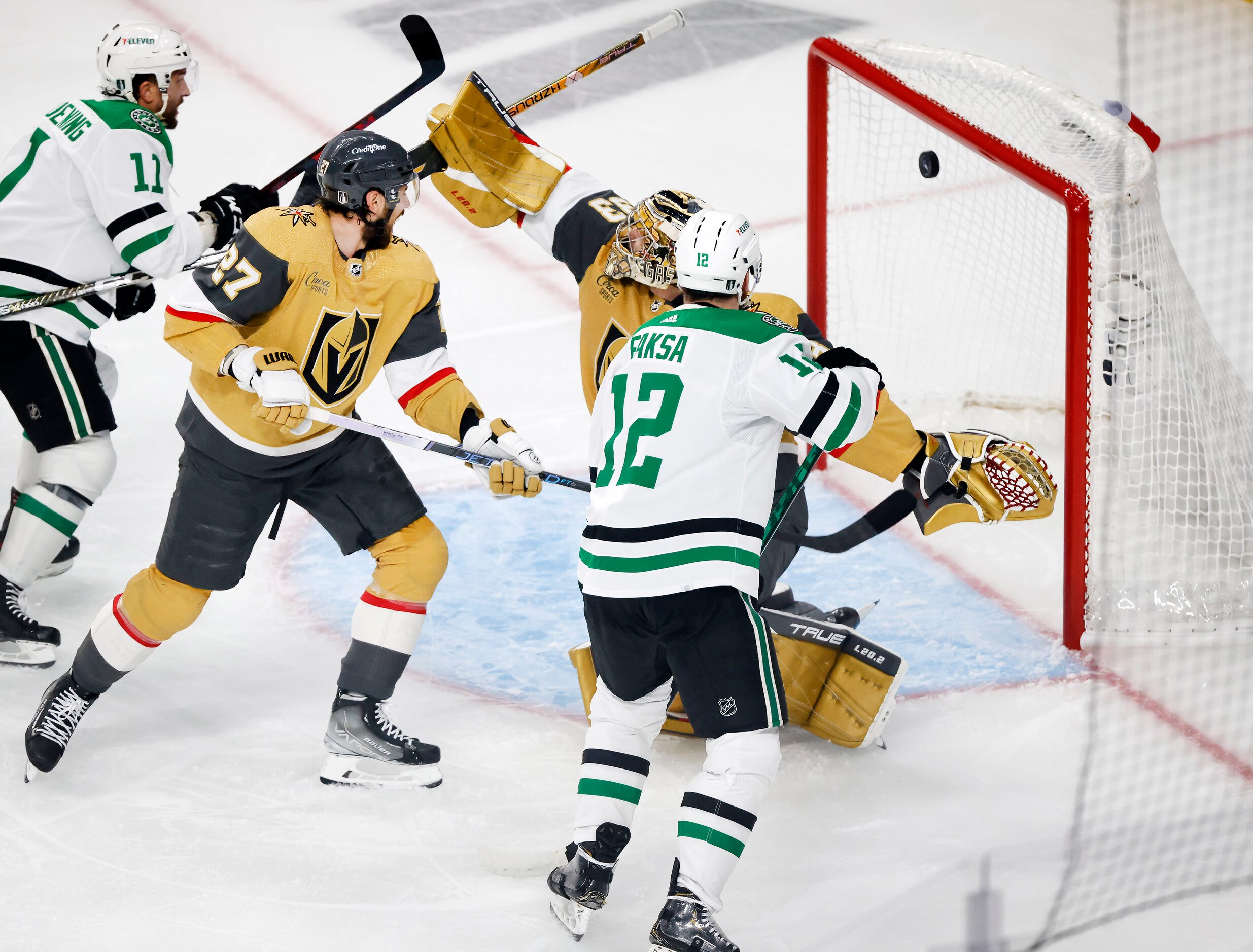 Dallas Stars center Radek Faksa (12) scores on Vegas Golden Knights goaltender Adin Hill...