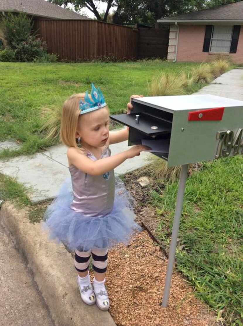 
Clementine checks the mail in yet another one of her creative outfits.
