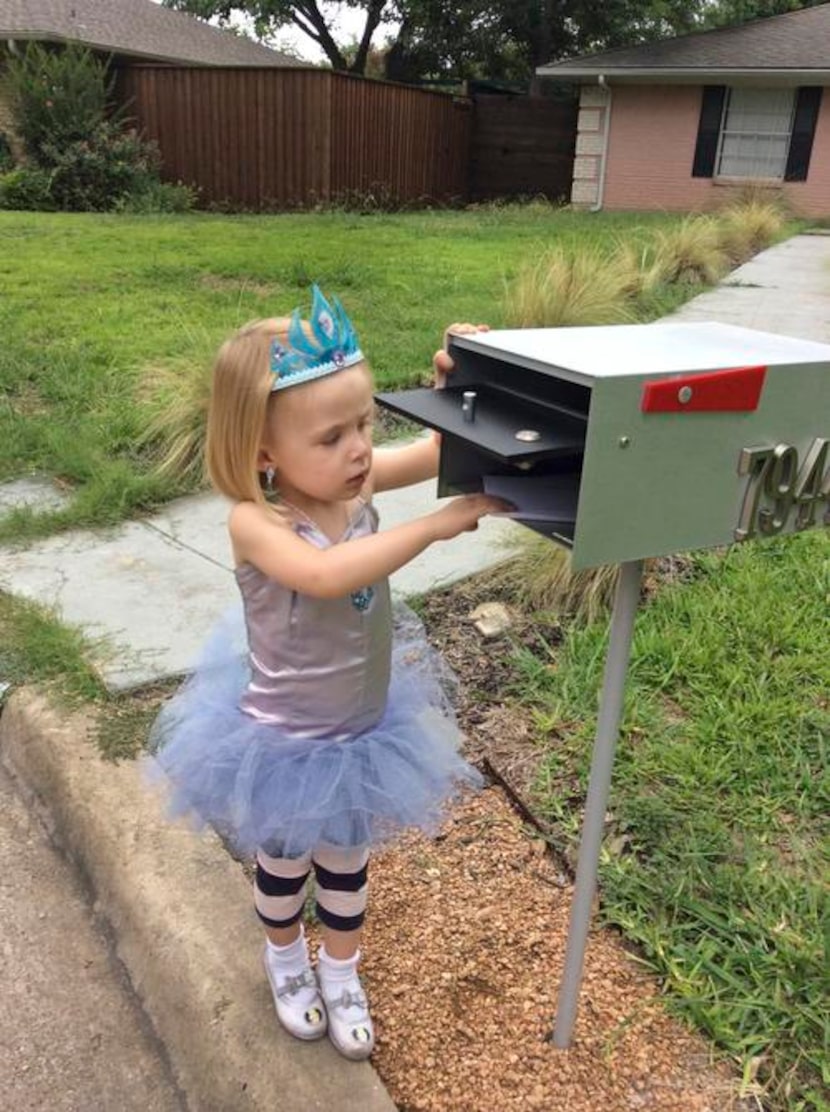 
Clementine checks the mail in yet another one of her creative outfits.
