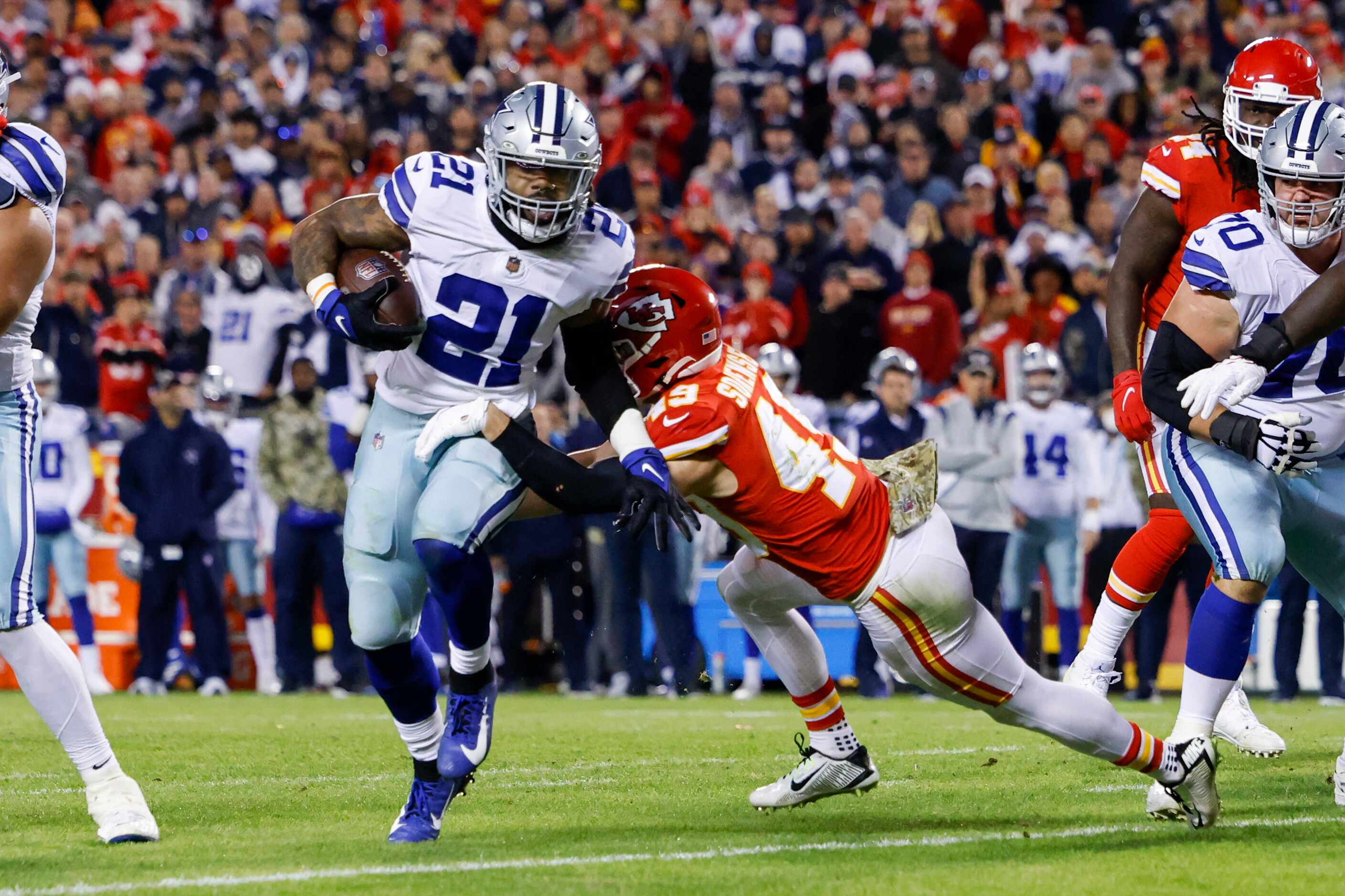 Kansas City Chiefs safety Daniel Sorensen (49) tackles Dallas Cowboys running back Ezekiel...