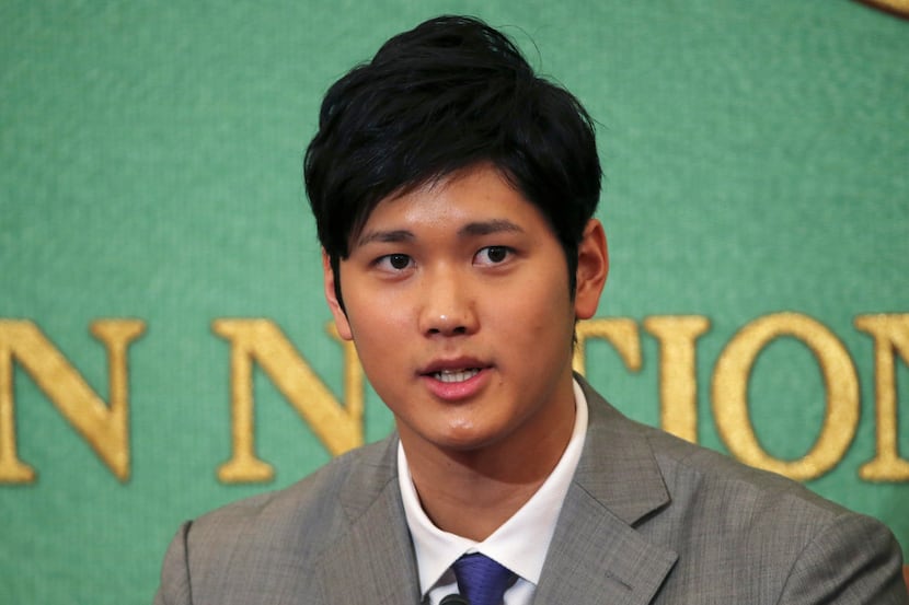 Japanese pitcher-outfielder Shohei Otani speaks during a press conference at Japanese...