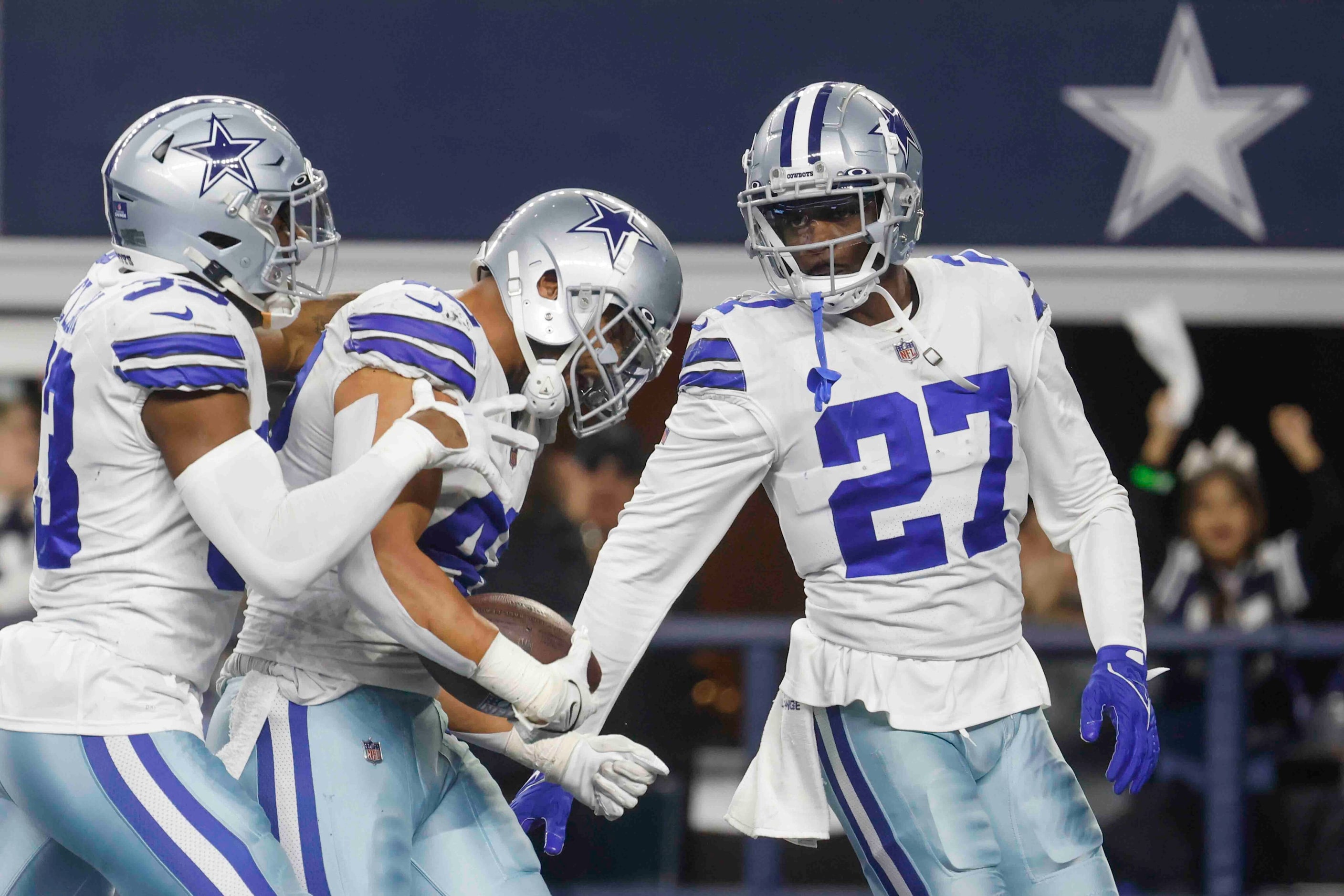 Dallas Cowboys linebacker Anthony Barr (42) celebrates with teammates after recovering a...