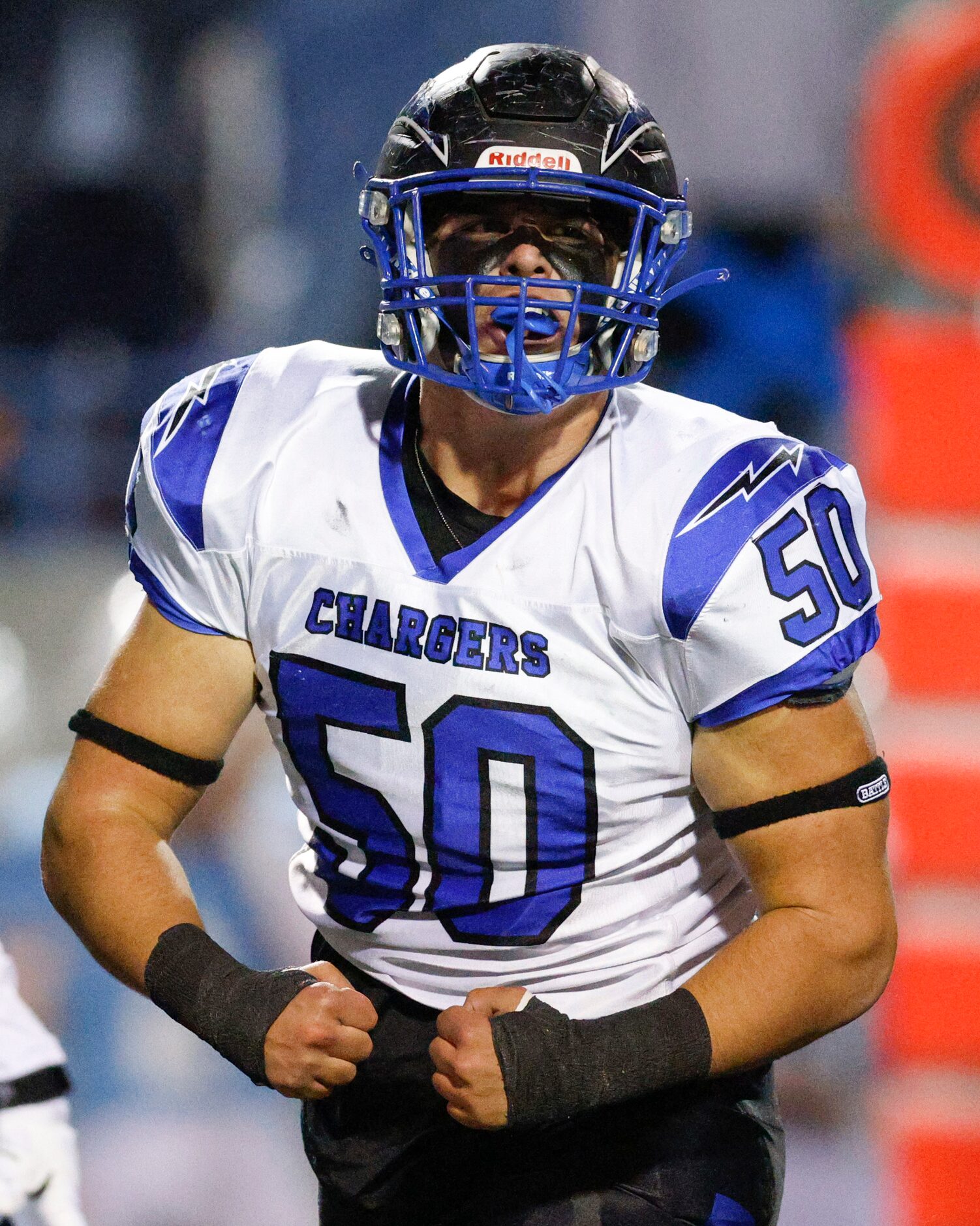 Dallas Christian defensive lineman Porter Nix (50) flexes after a tackle during the first...