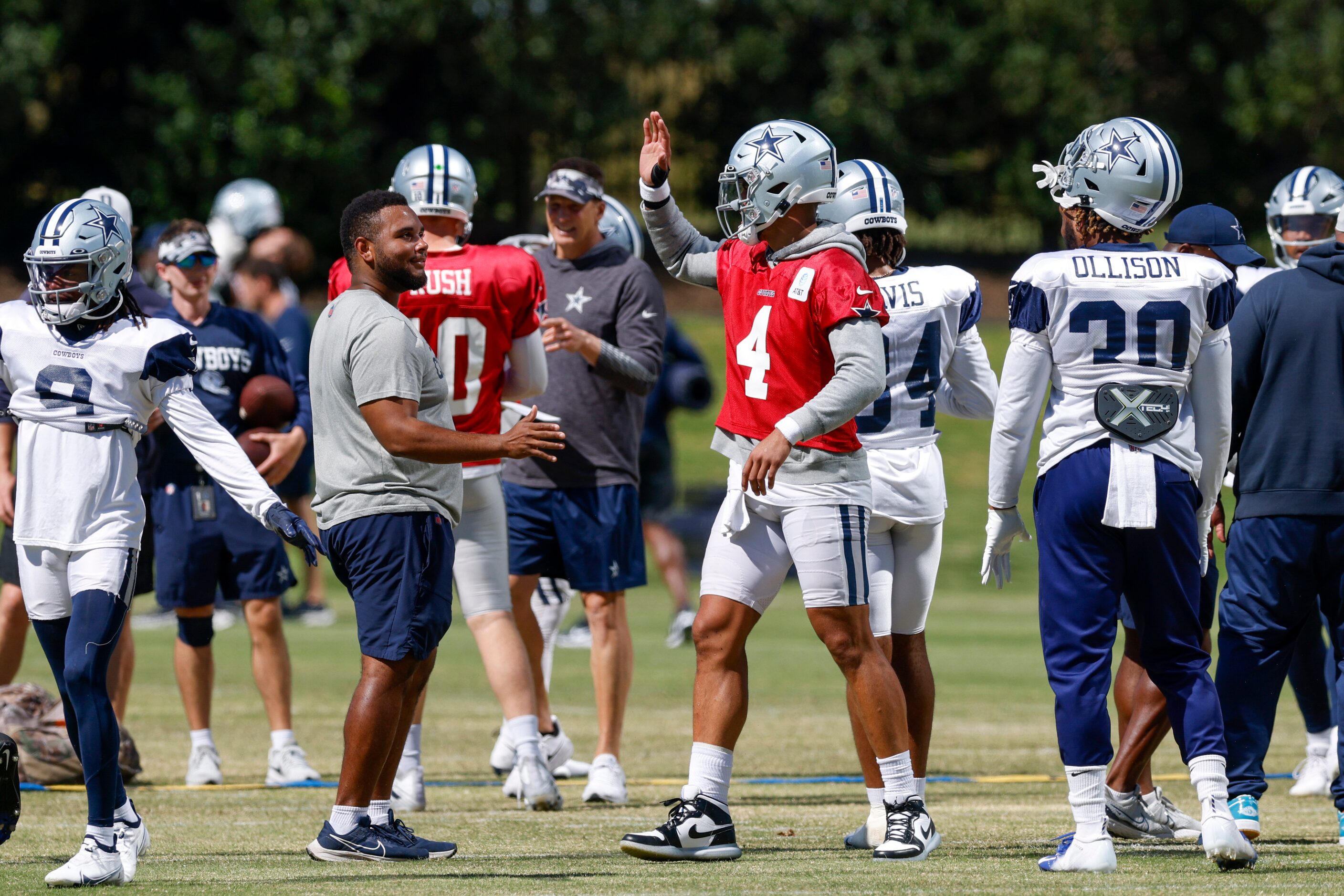 Dallas Cowboys quarterback Dak Prescott (4) greets teammates during a practice at The Star,...