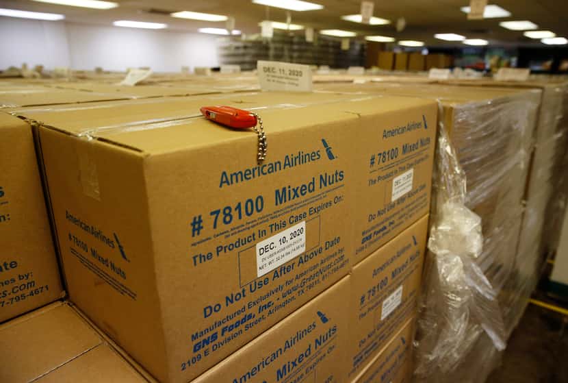 Boxes of mixed nuts sit at GNS Foods in Arlington. GNS last year sold airlines 12 million...