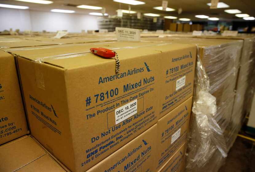 Boxes of mixed nuts sit at GNS Foods in Arlington. GNS last year sold airlines 12 million...