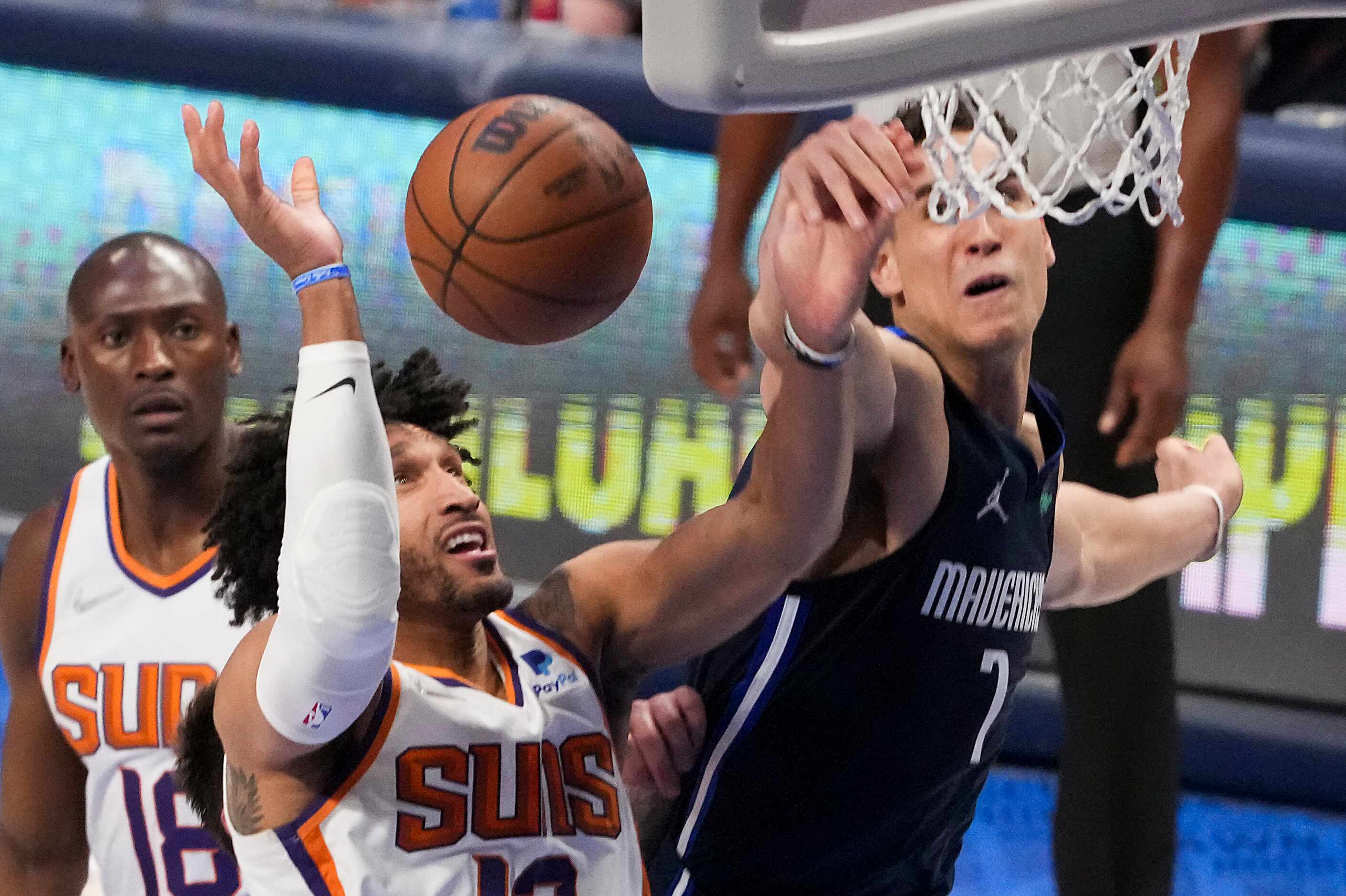 Dallas Mavericks center Dwight Powell (7) blocks a shot by Phoenix Suns forward Ish...