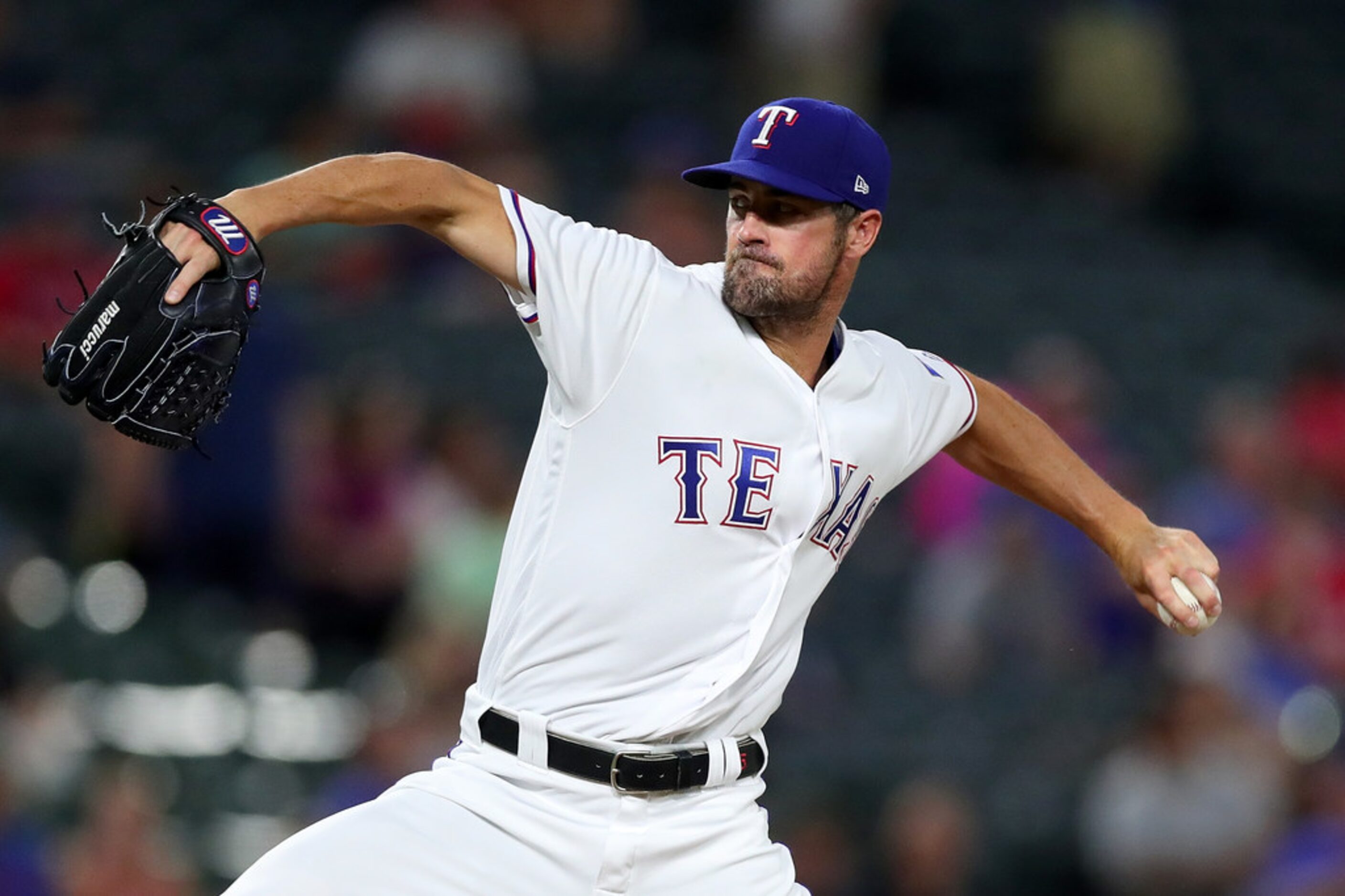 ARLINGTON, TX - JULY 23:  Cole Hamels #35 of the Texas Rangers pitches against the Oakland...