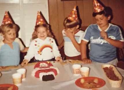 David Weigand (right), a West Virginia native, ​​​at a birthday party when he was around 11...