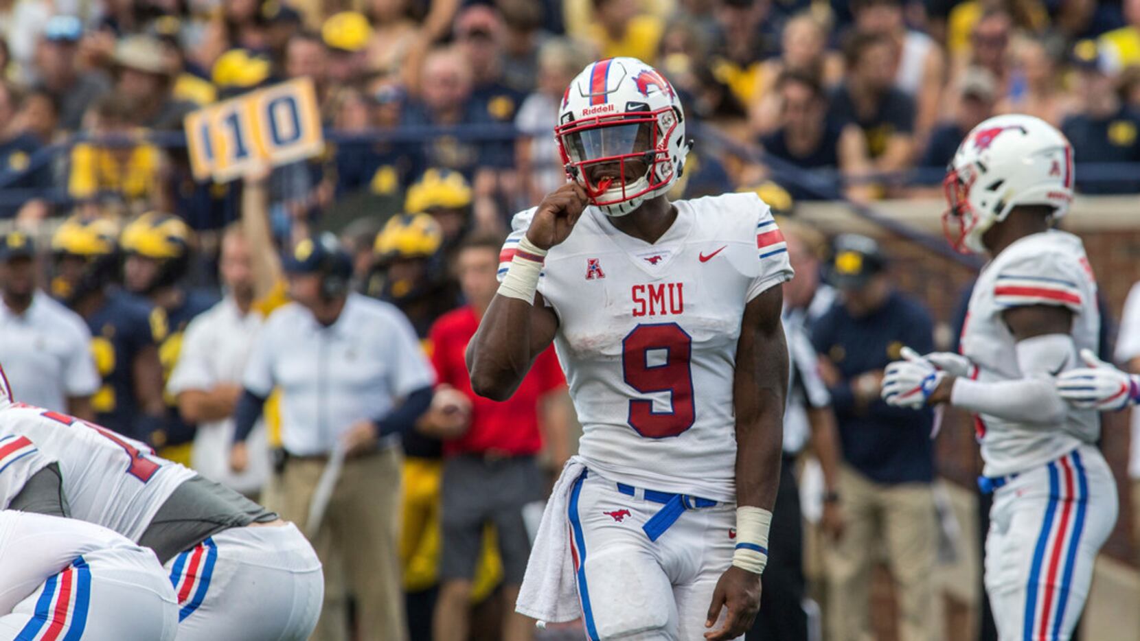 SMU quarterback William Brown (9) looks to his sideline between downs in the third quarter...