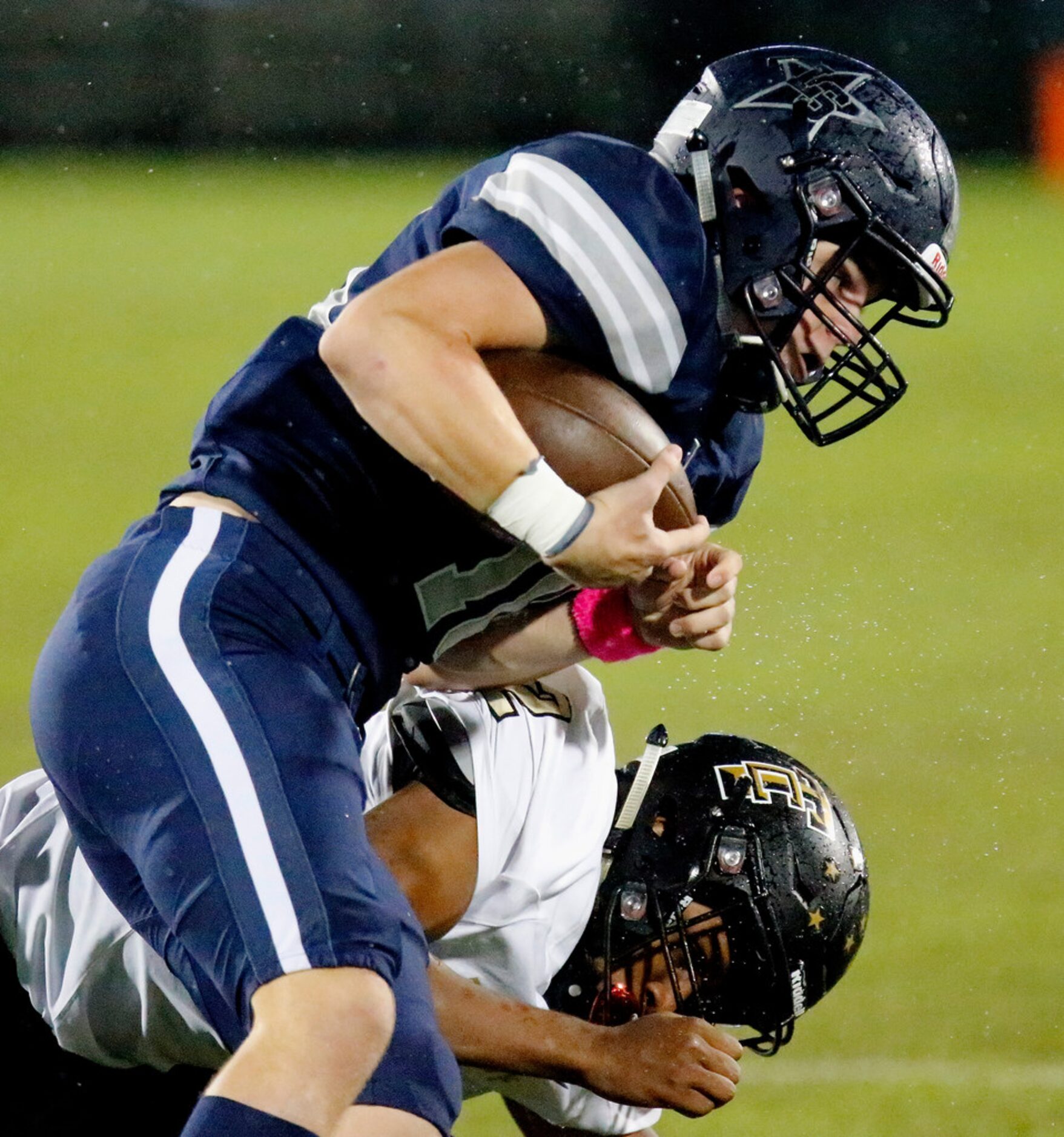 Lone Star High School wide receiver Jake Bogdon (10) is hit and taken down by The Colony...