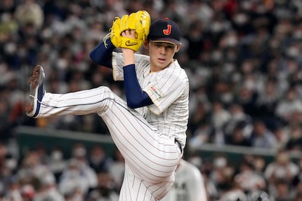 FILE - Roki Sasaki, of Japan pitches, during their Pool B game against the Czech Republic at...