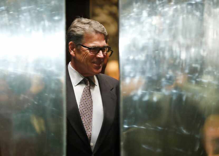 An elevator door closes as former  Gov. Rick Perry arrives at Trump Tower, Monday, Nov. 21,...