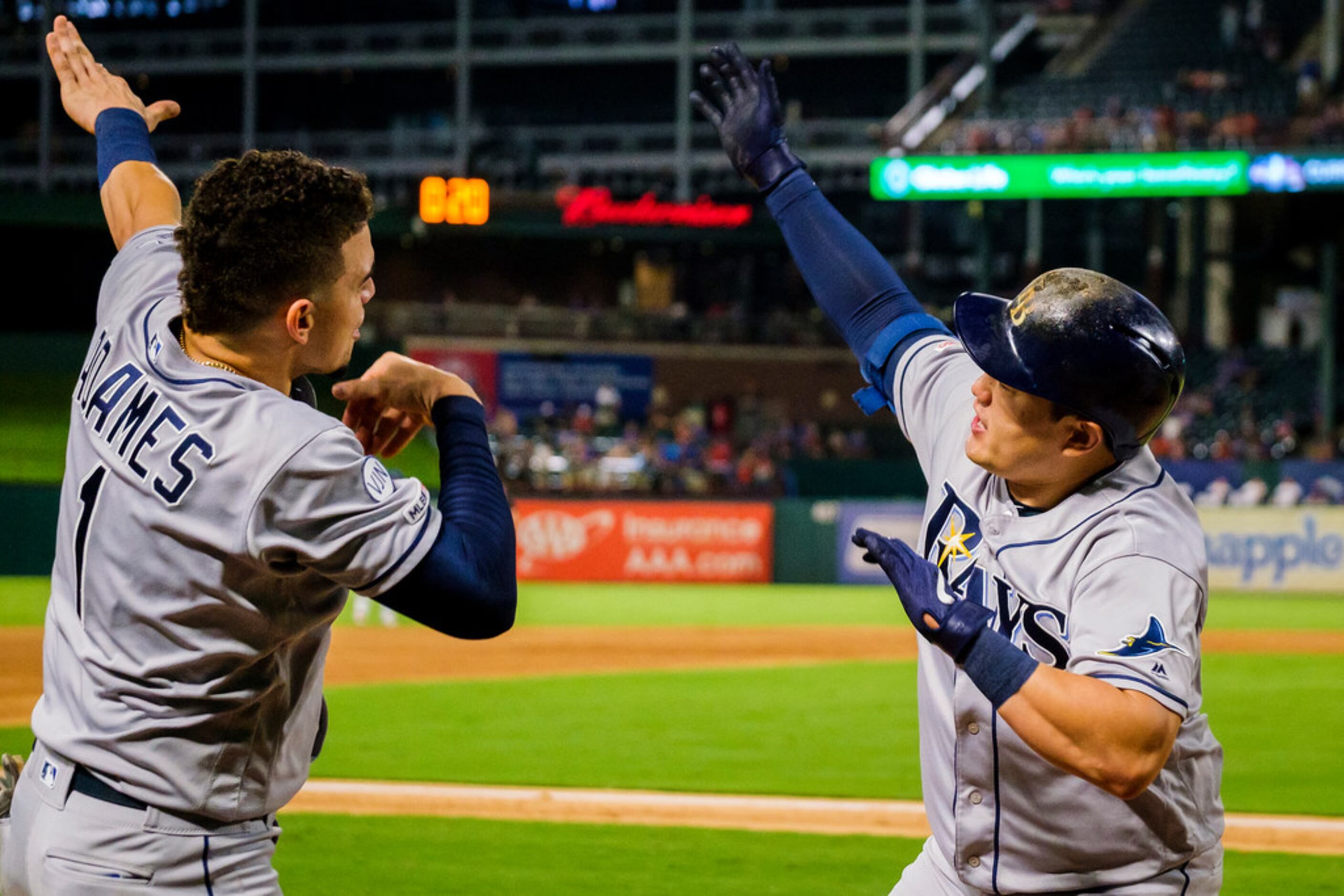 Tampa Bay Rays first baseman Ji-Man Choi celebrates with shortstop Willy Adames (1) after...
