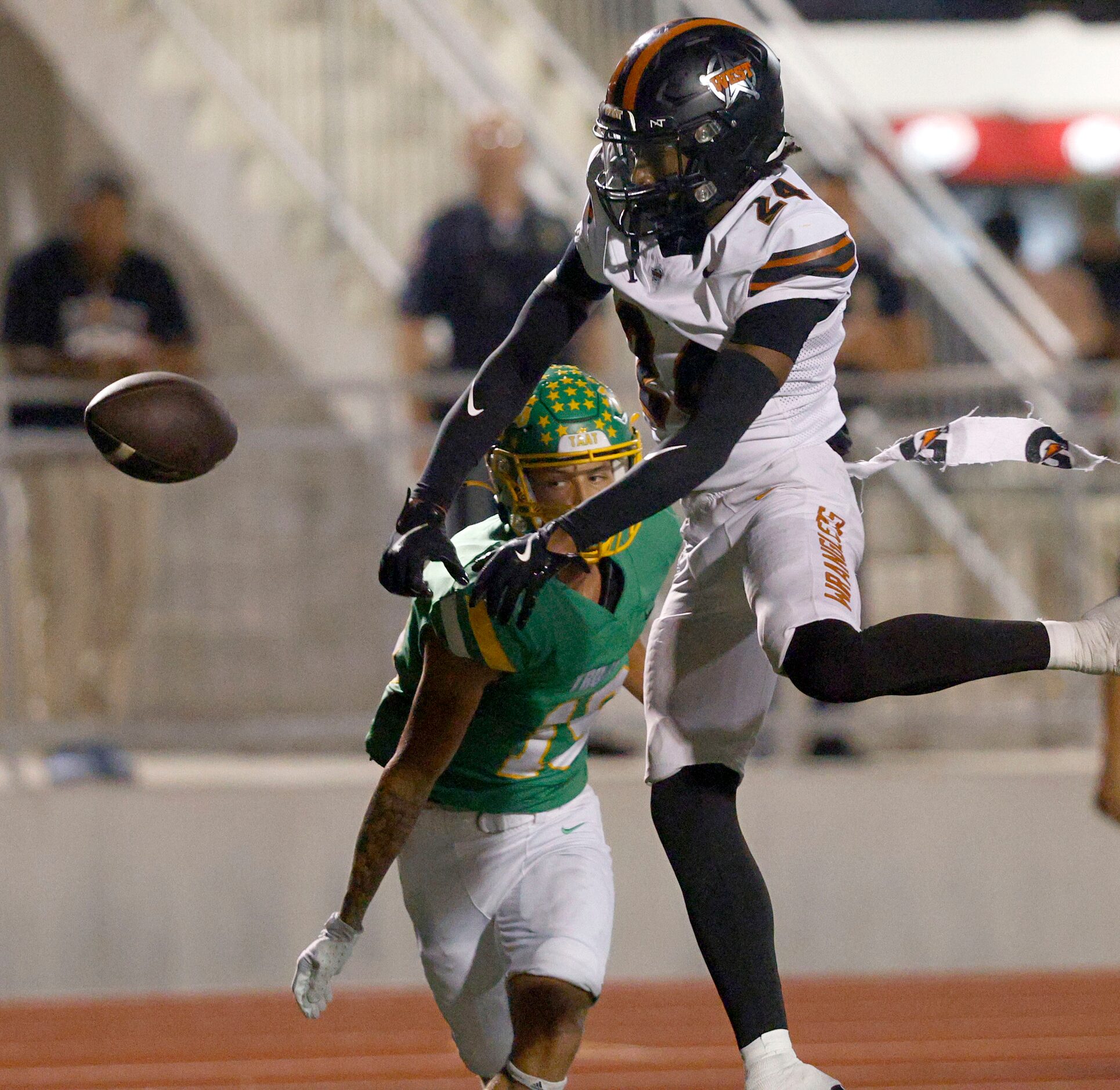 West Mesquite's Christian Malveaux (24) attempts to intercepts a pass intended for Newman...