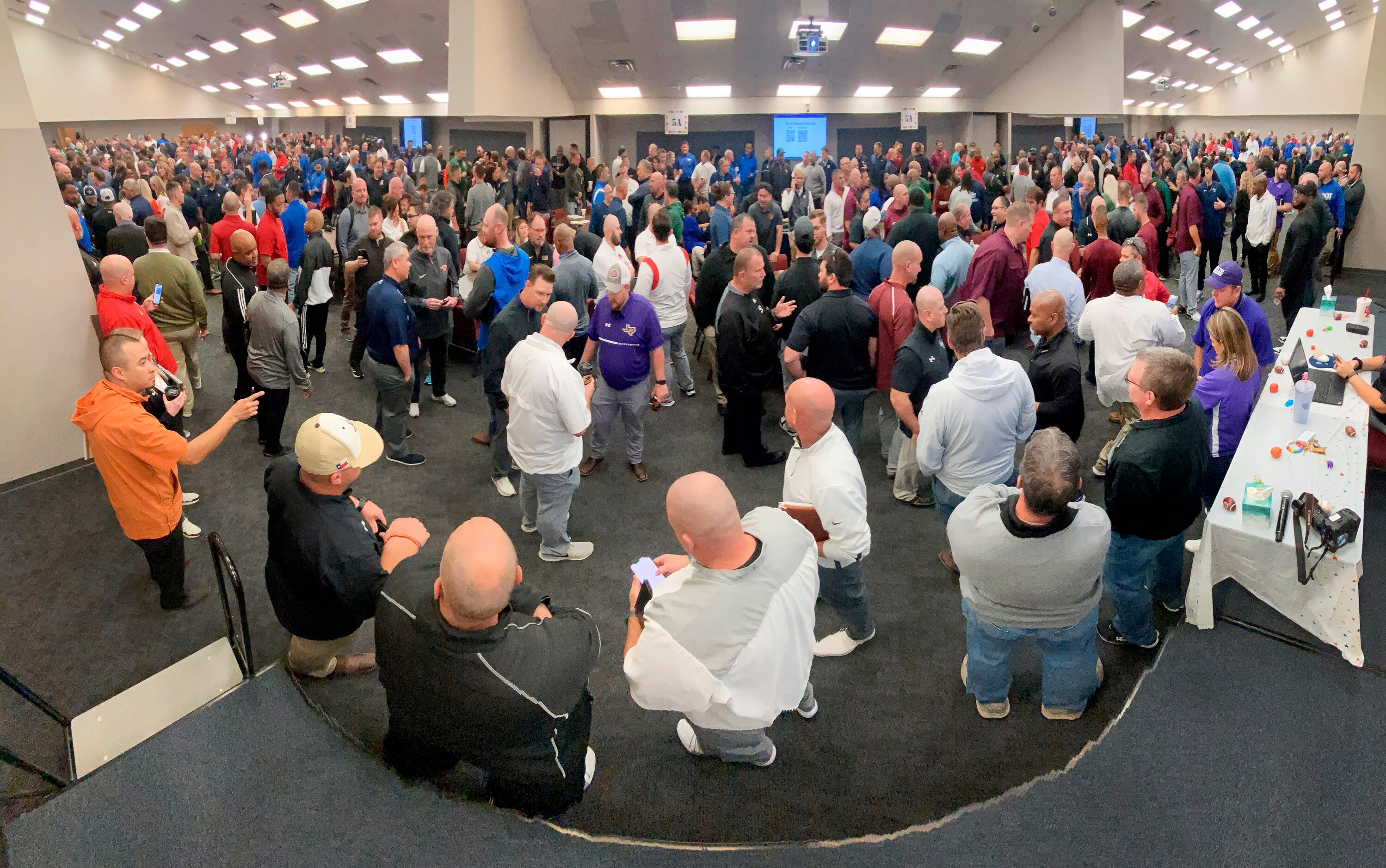 A panoramic image shows high school coaches and athletic directors from 6A (left), 5A...