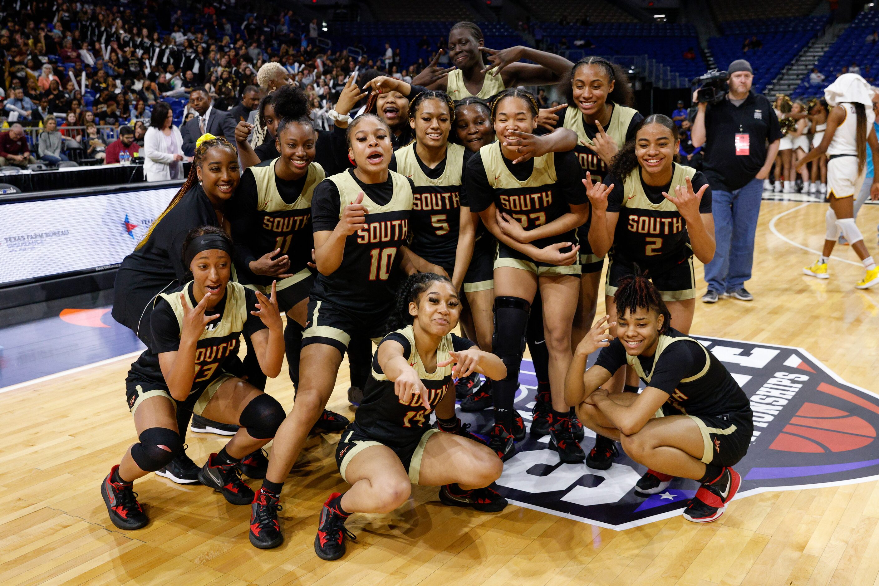 South Grand Prairie pose for photos after defeating Humble Summer Creek in a Class 6A state...