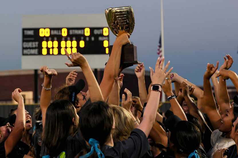 Prosper Rock Hill players hold up their trophy after defeating Royse City 1-0 to sweep the...