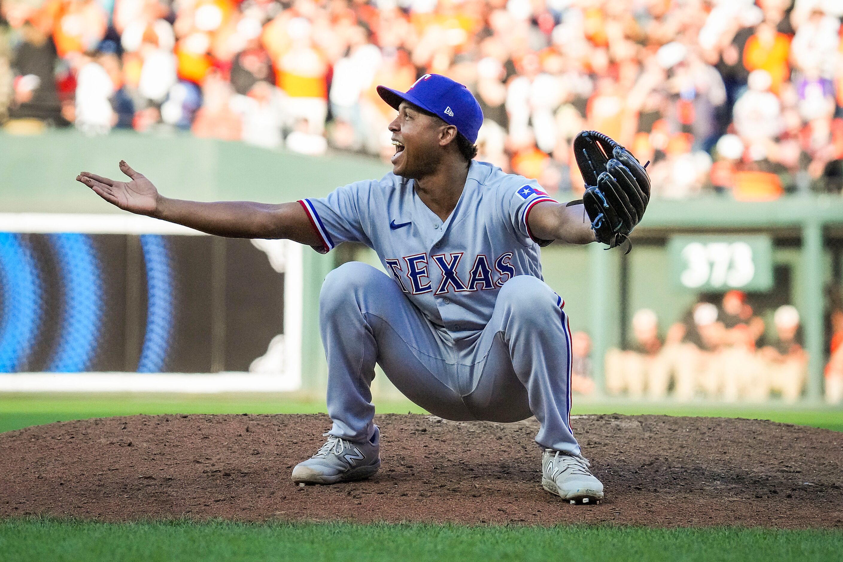 Texas Rangers relief pitcher Jose Leclerc celebrates after the final out of a 3-2 victory...