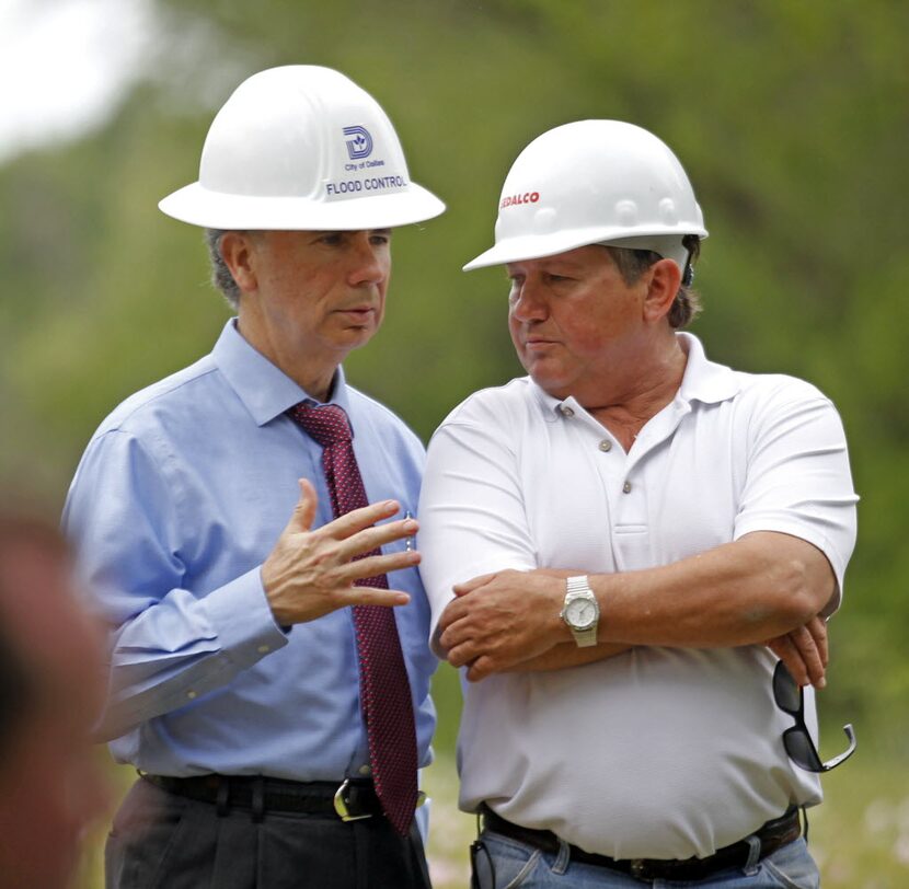 Then-City Manager A.C. Gonzalez talked to  Wayne Kirk (right) as City Council members toured...