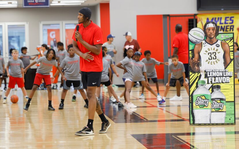 Indiana Pacers Center Myles Turner speaks to campers as he hosts a basketball camp at Drive...