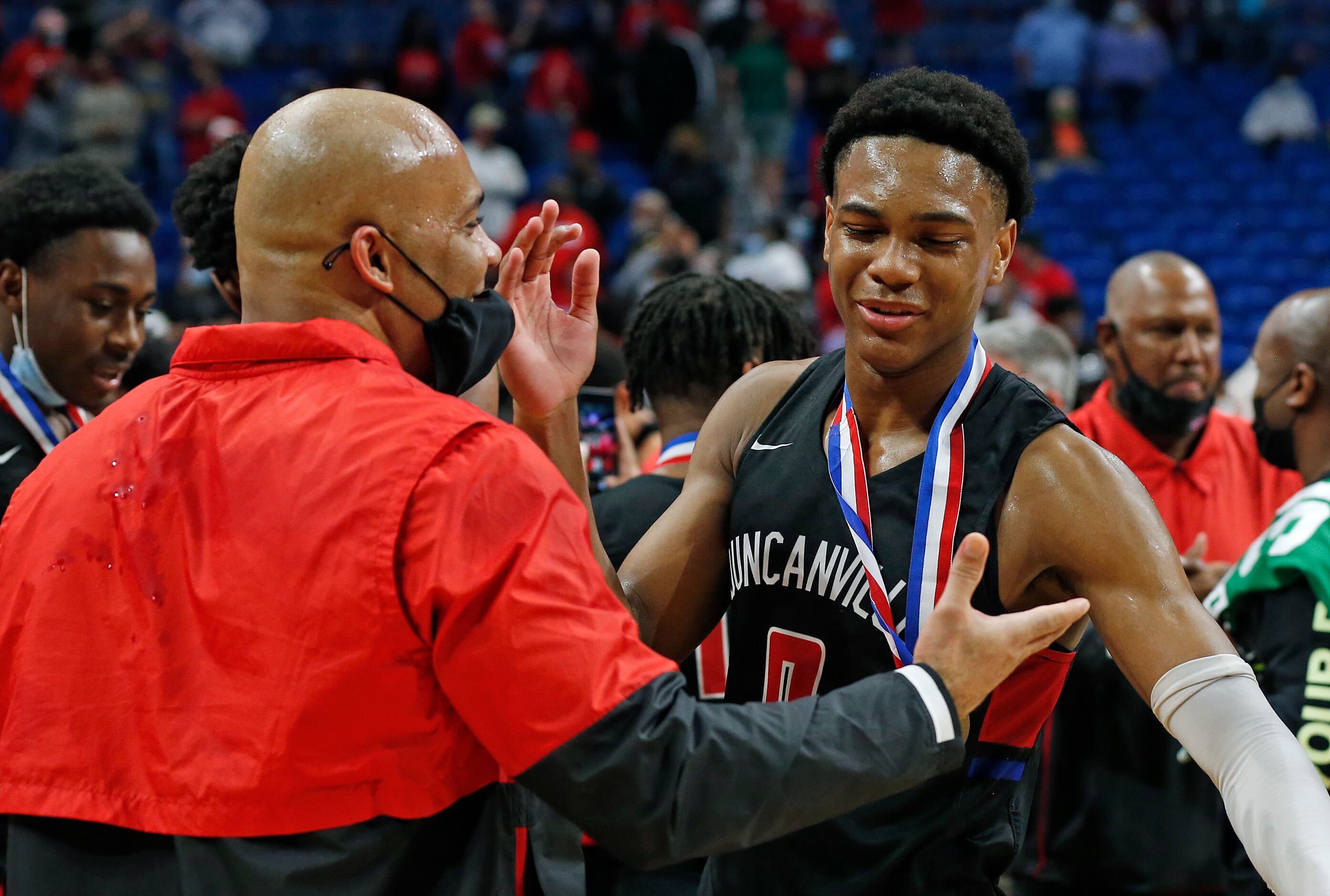 Duncanville Zhuric Phelps #0 is congratulated by Duncanville head coach David Peavy. UIL...