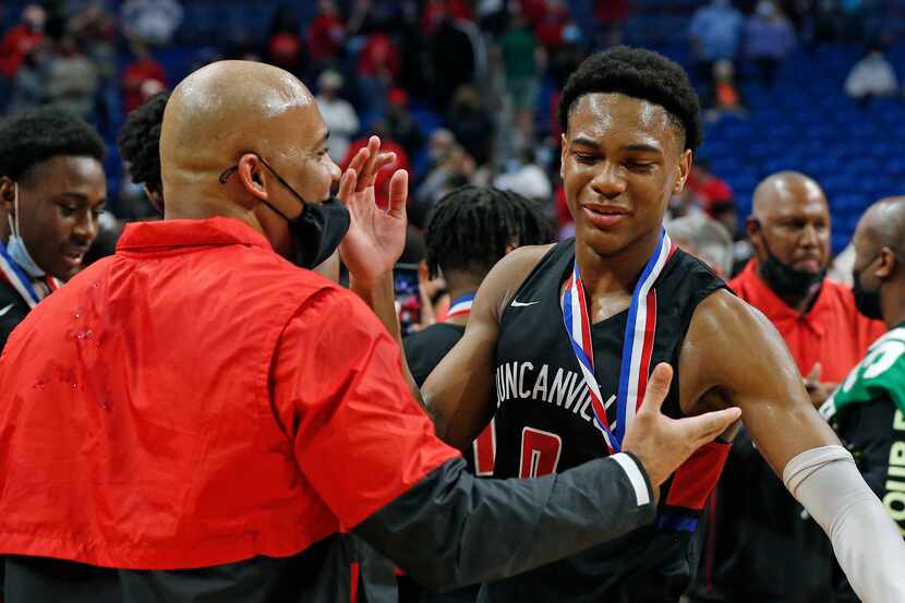 Duncanville Zhuric Phelps #0 is congratulated by Duncanville head coach David Peavy. UIL...