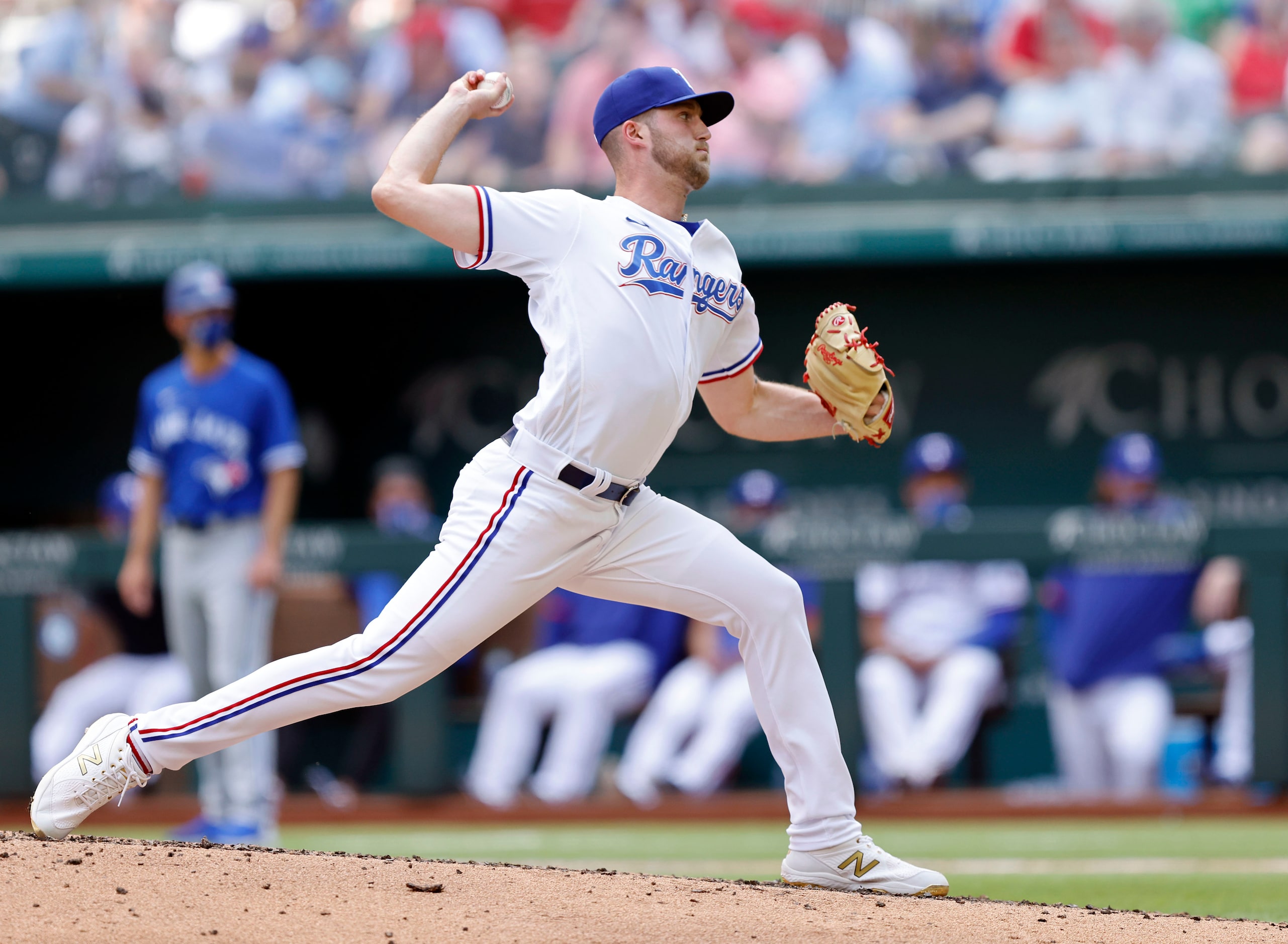 Texas Rangers starting pitcher Kyle Cody (54) throws against the Toronto Blue Jays in the...