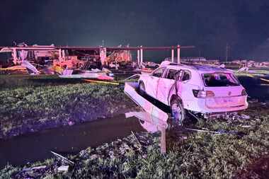 Tornado damage at a Shell gasoline station near Interstate 35 and Lone Oak Road on Sunday,...