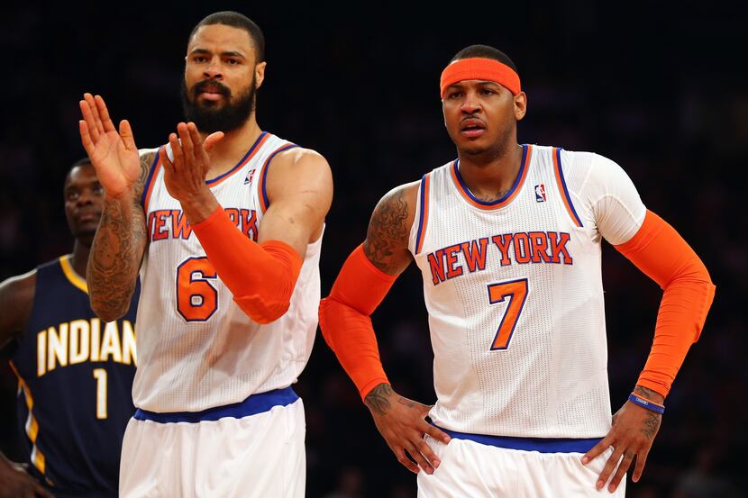Tyson Chandler (6) of the New York Knicks and Carmelo Anthony #7 react after a play against...