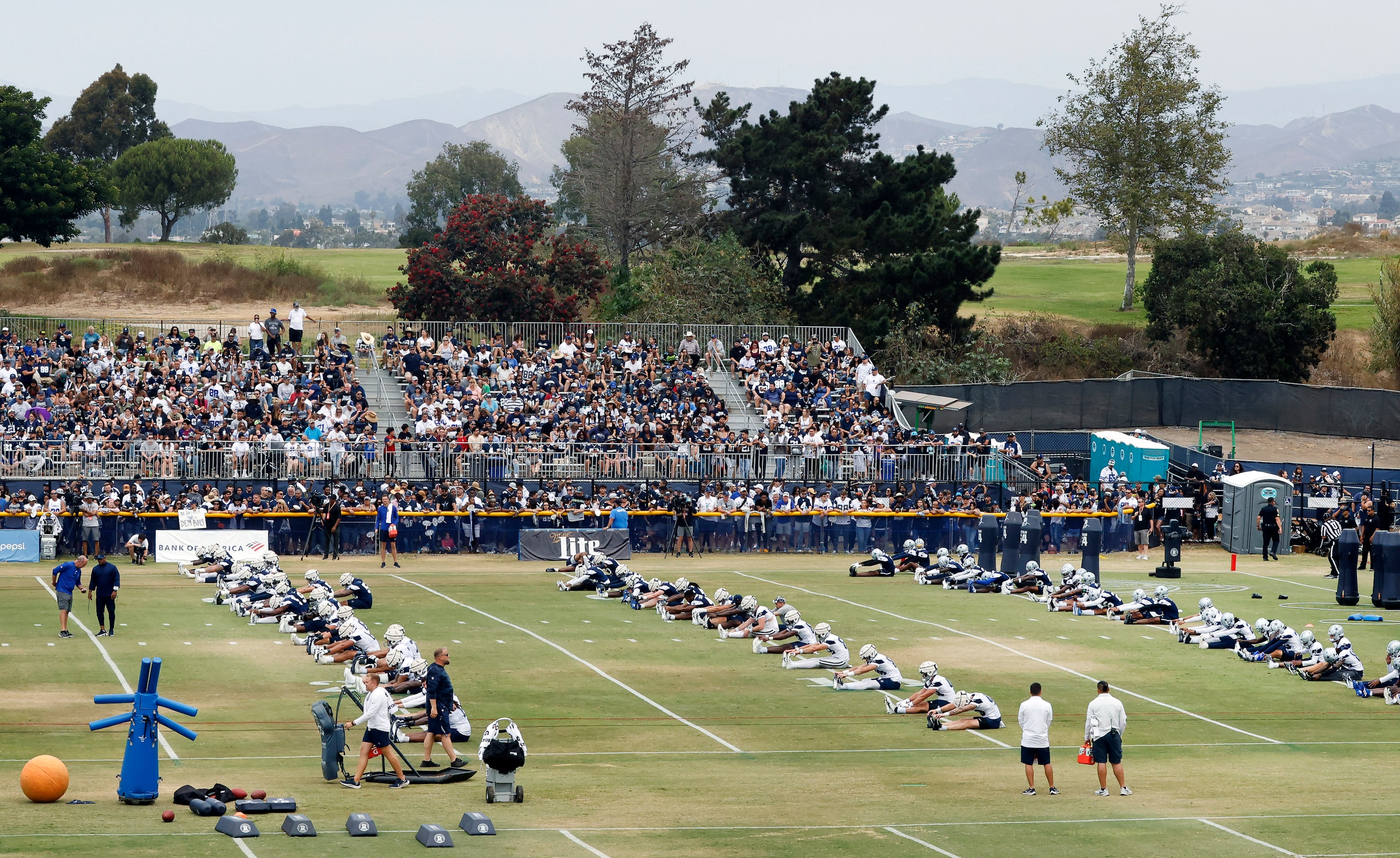 The Dallas Cowboys football team trains before over 4,000 fans at the Cowboys training camp...