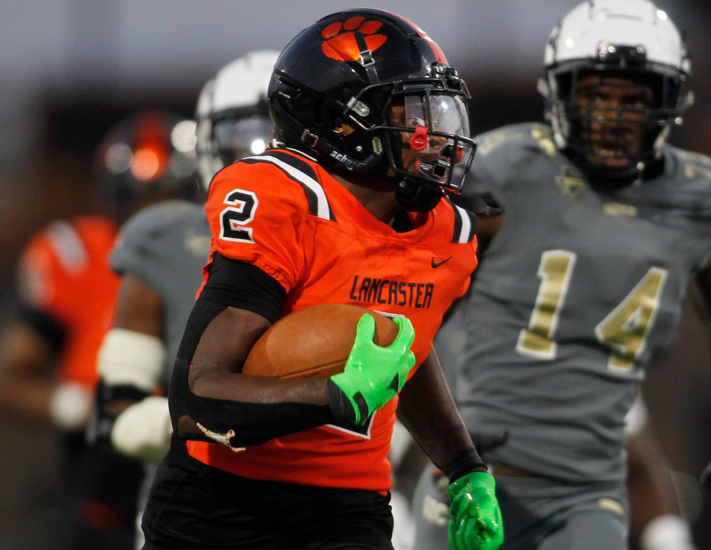 Lancaster running back Kewan Lacy (2) rambles through the South Oak Cliff secondary for a...