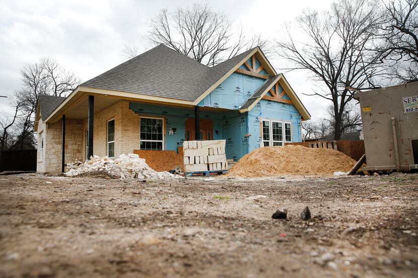 Two workers and two of their children were sleeping in an unfinished house in the 1400 block...