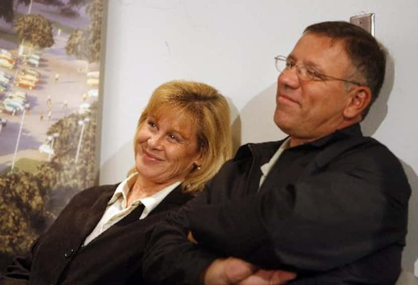 Tony Romo's parents Joan and Ramiro Romo watch the press conference after Romo signed a new...