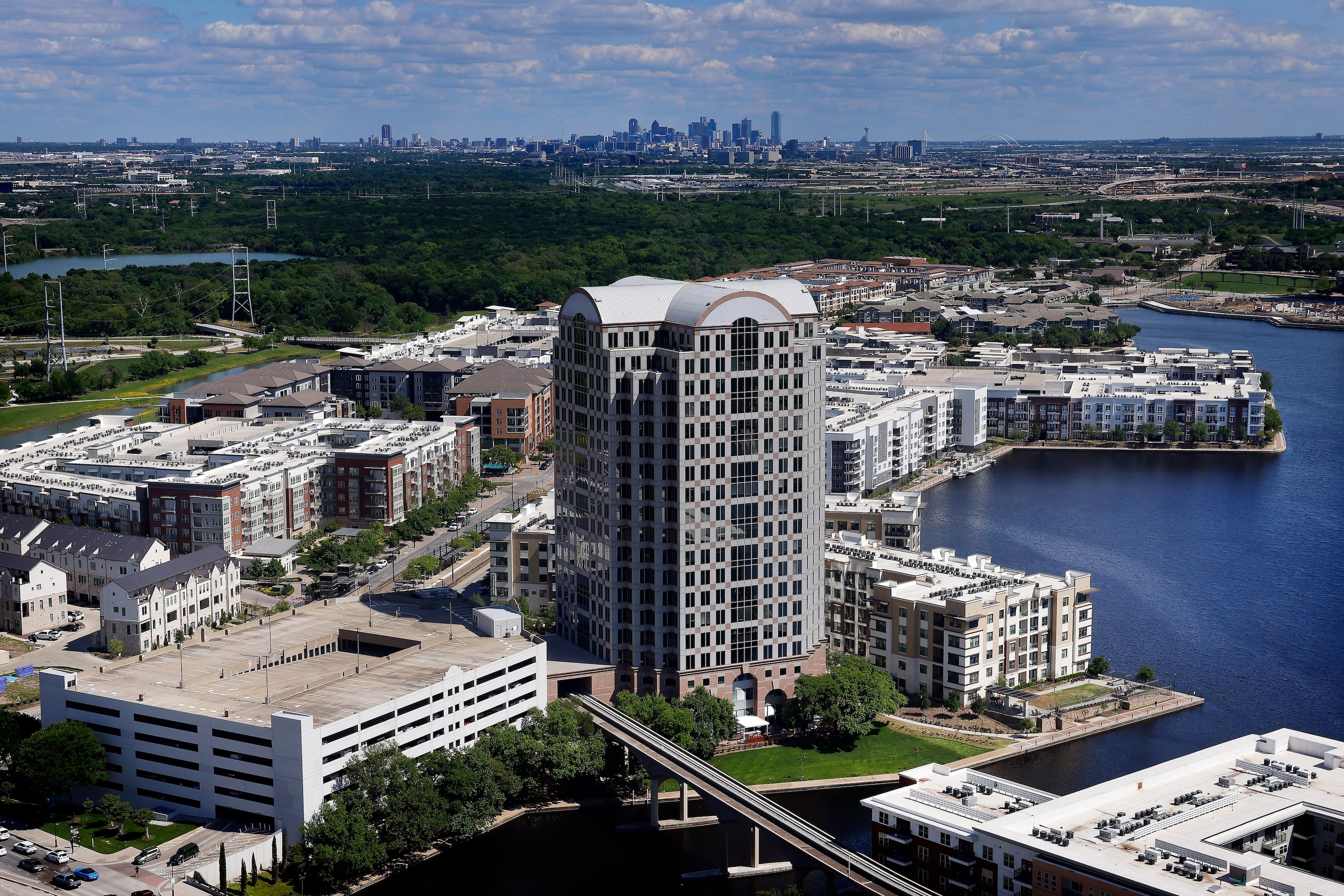 Office buildings, blocks of apartment buildings and the Dallas skyline can be viewed from...