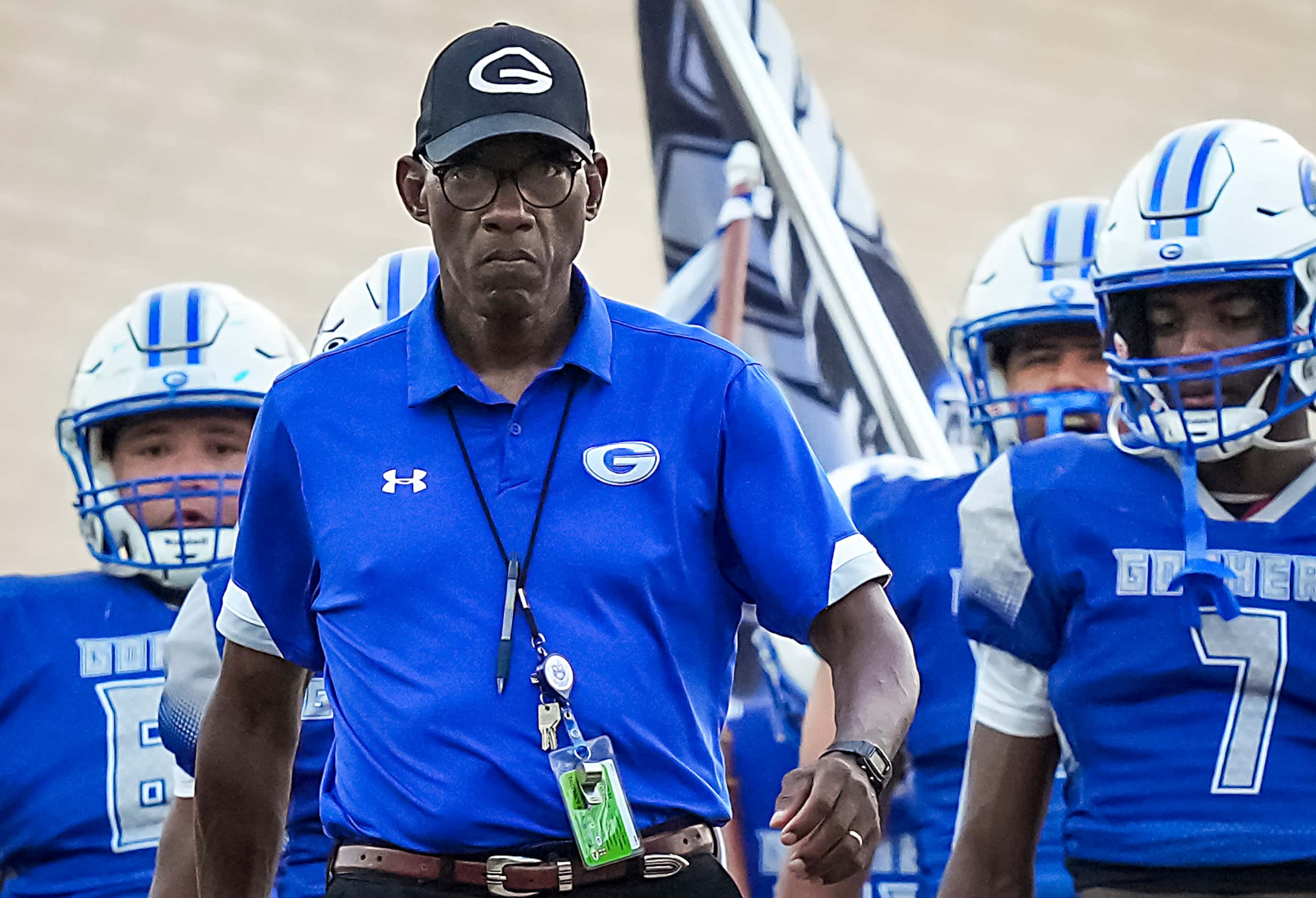 Grand Prairie head coach Tony Tademy leads his team as they prepare to take the field for a...