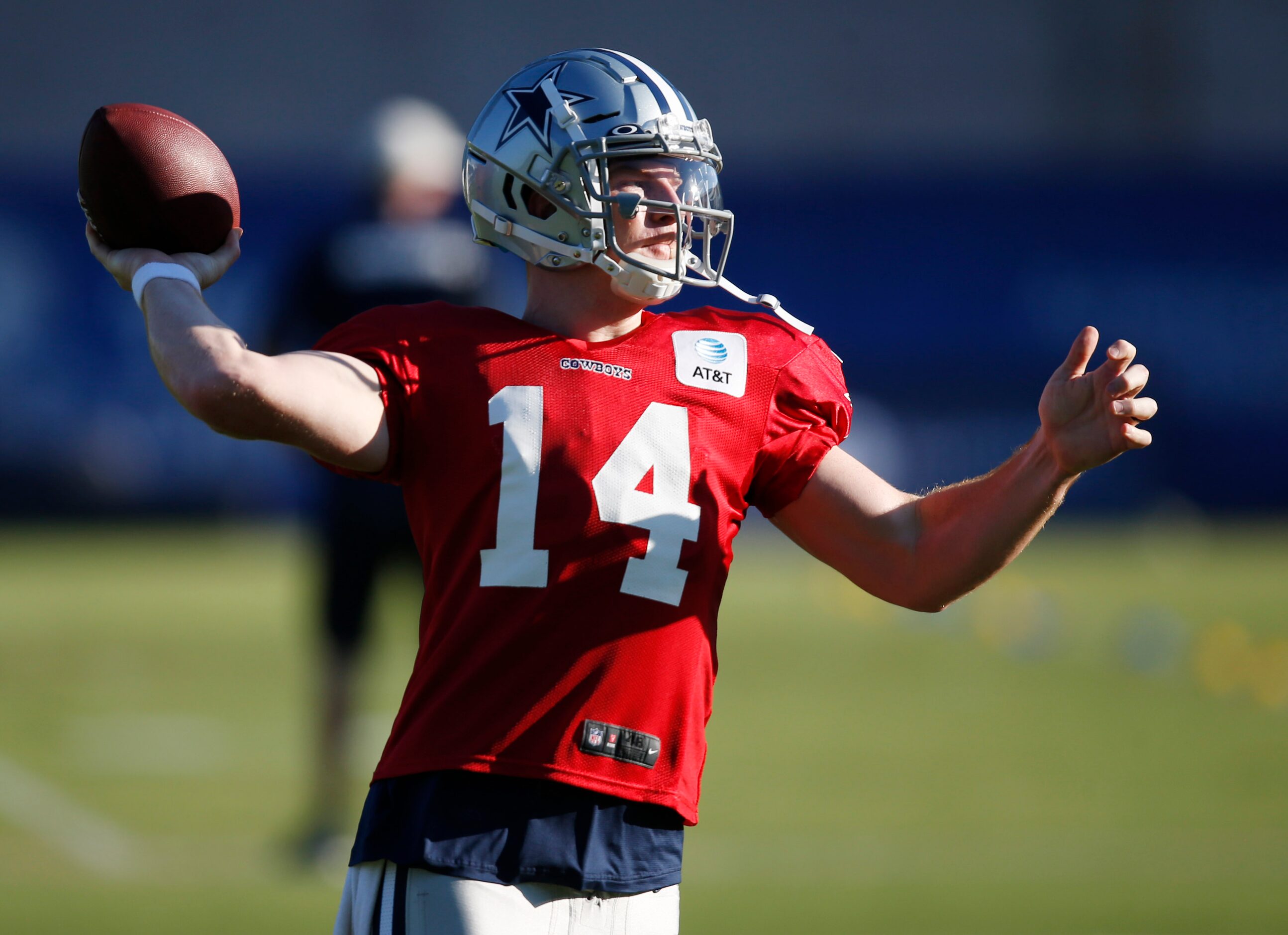 Dallas Cowboys quarterback Andy Dalton (14) throws the ball in a drill during training camp...