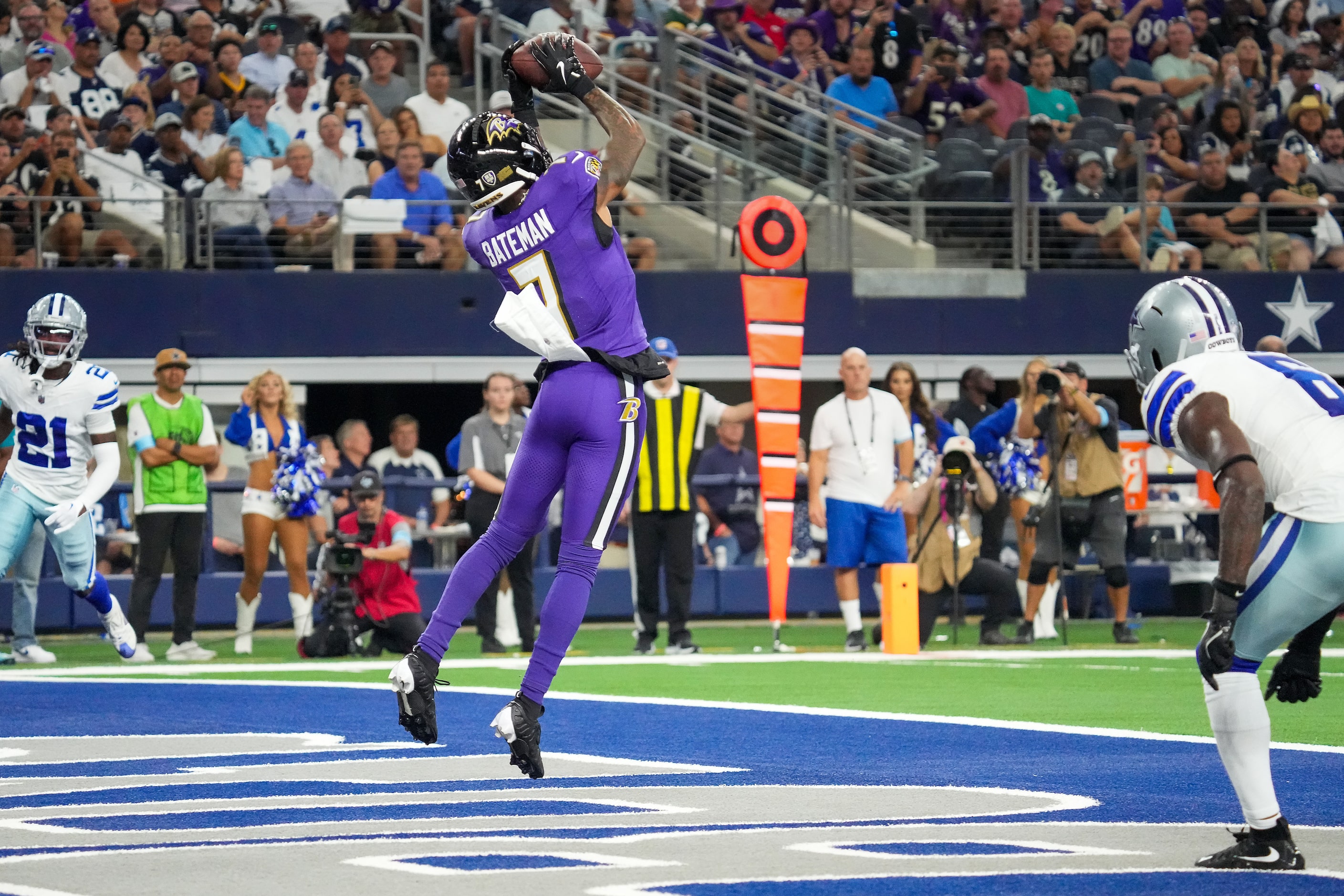 Baltimore Ravens wide receiver Rashod Bateman (7) catches a touchdown  pass between Dallas...