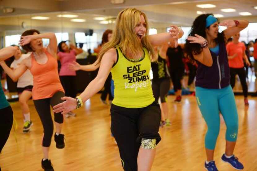 Tammy Elliott leads a Zumba class at Texas Family Fitness on March 29 in Frisco. Elliott, a...
