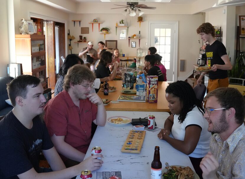 Members of the Dallas Sunrise Movement celebrate the city's pilot program to offer DISD...