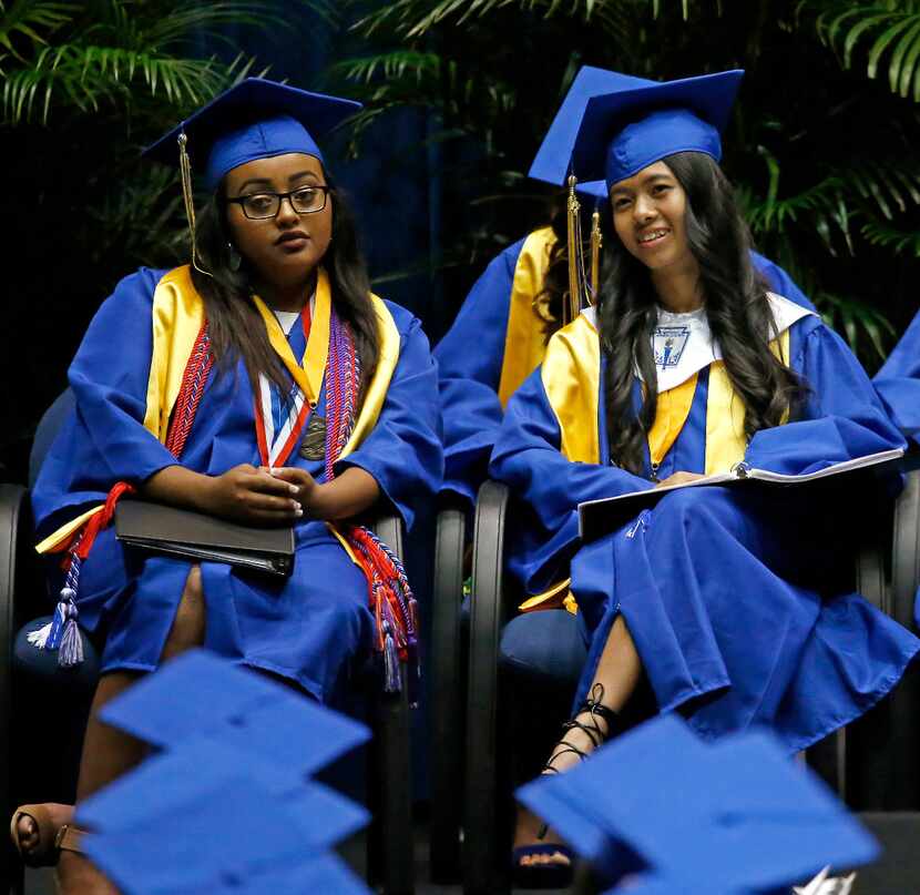 Valedictorian Eleni T-Giorgs (left) and Salutatorian Bae Shae attend the Emmet J. Conrad...