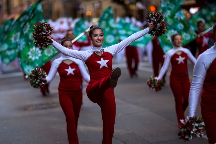 Cheerleaders march along Sixth Avenue during the Macy's Thanksgiving Day Parade in New York,...