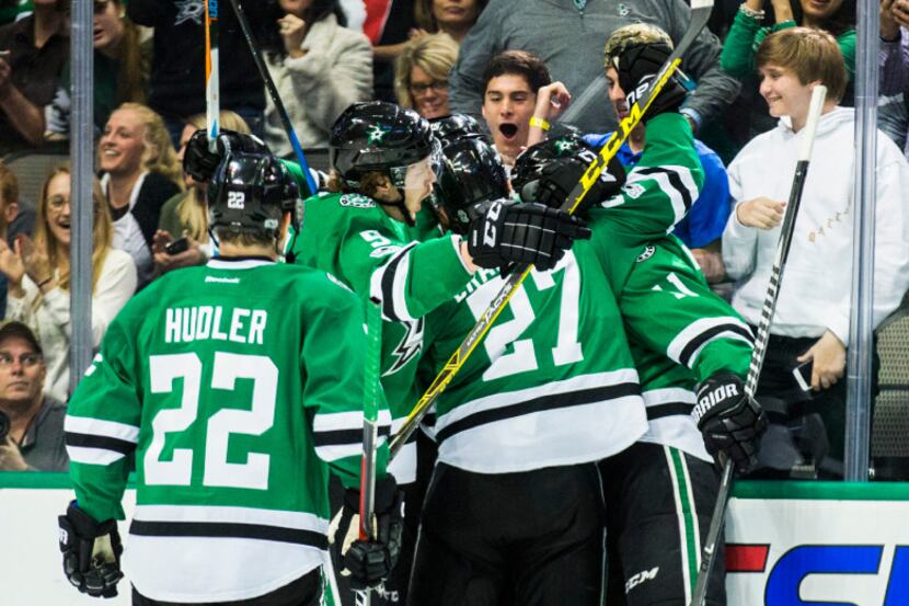 Dallas Stars celebrate a goal scored by left wing Curtis McKenzie (11) during the second...