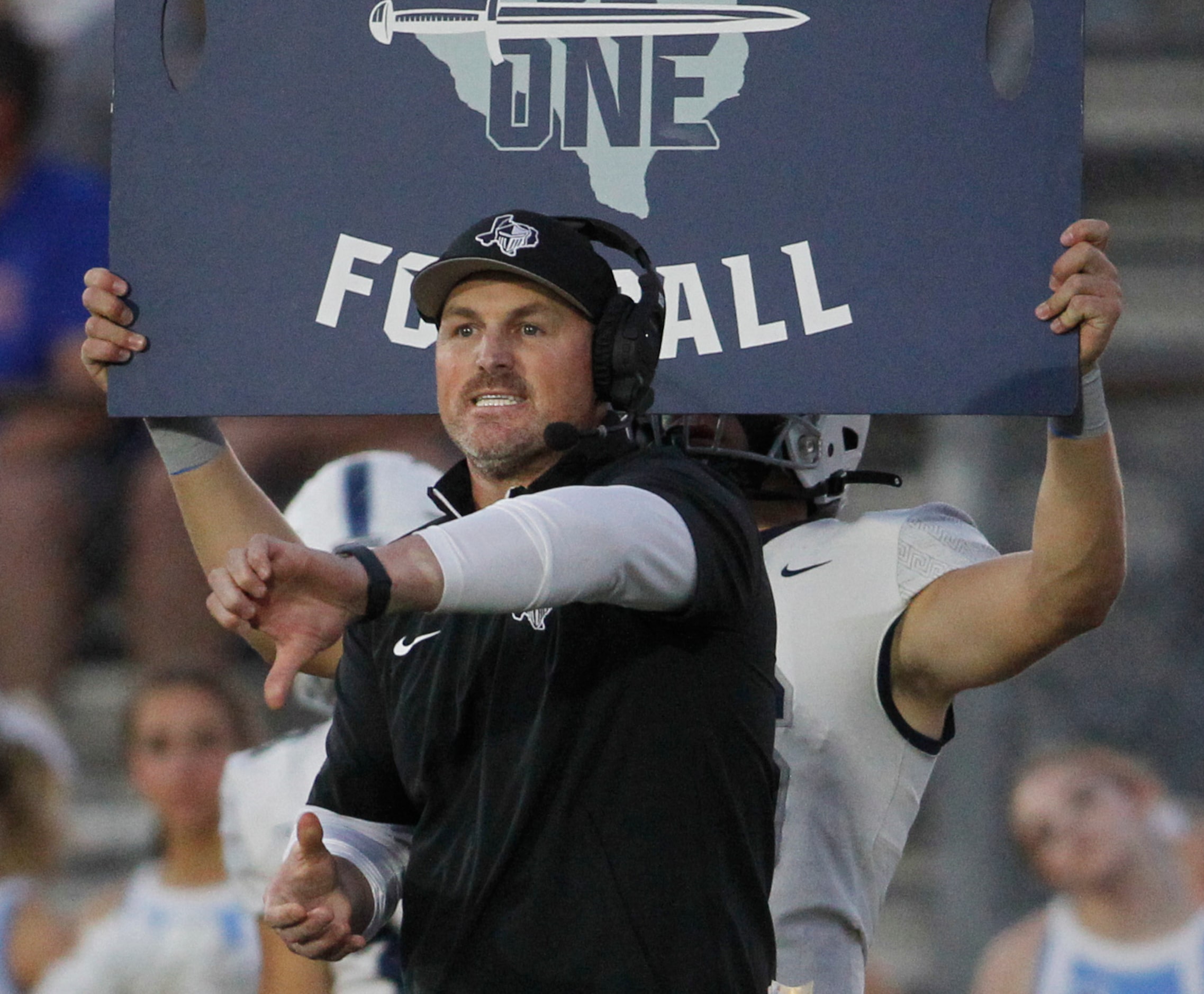 Argyle Liberty Christian head coach Jason Witten sends a play into his offense during first...