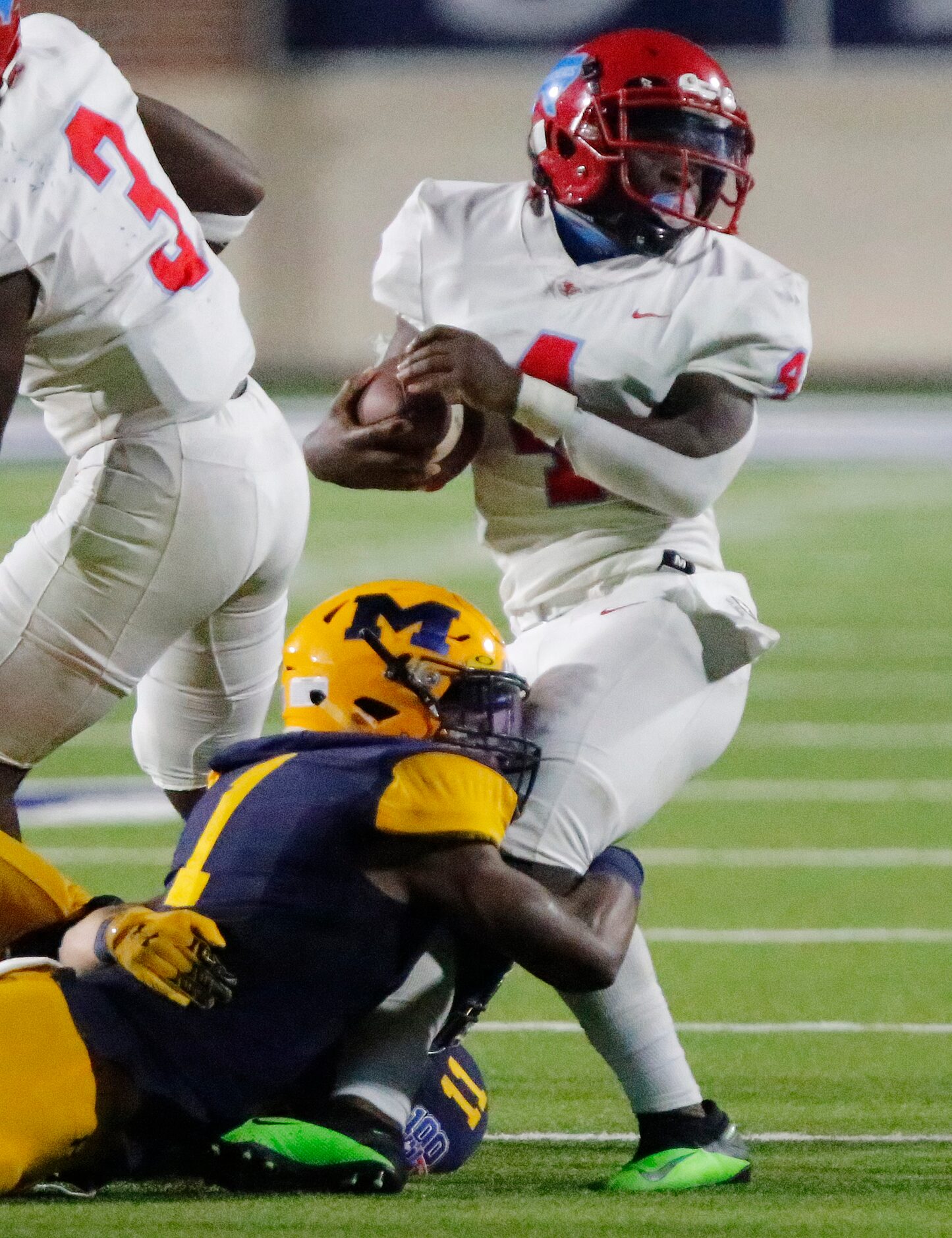 Skyline High School wide receiver Qualon Farrar (4) is tackled after the catch by McKinney...