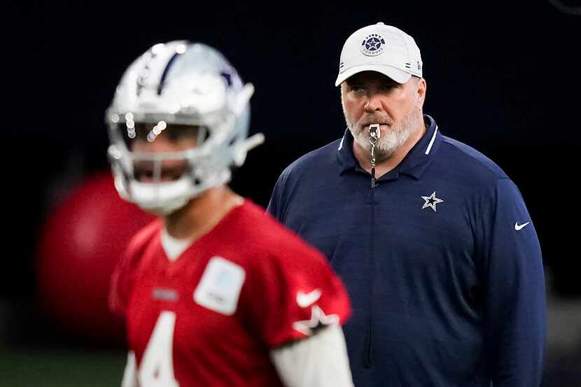 Dallas Cowboys head coach Mike McCarthy looks on as quarterback Dak Prescott (4) takes a...