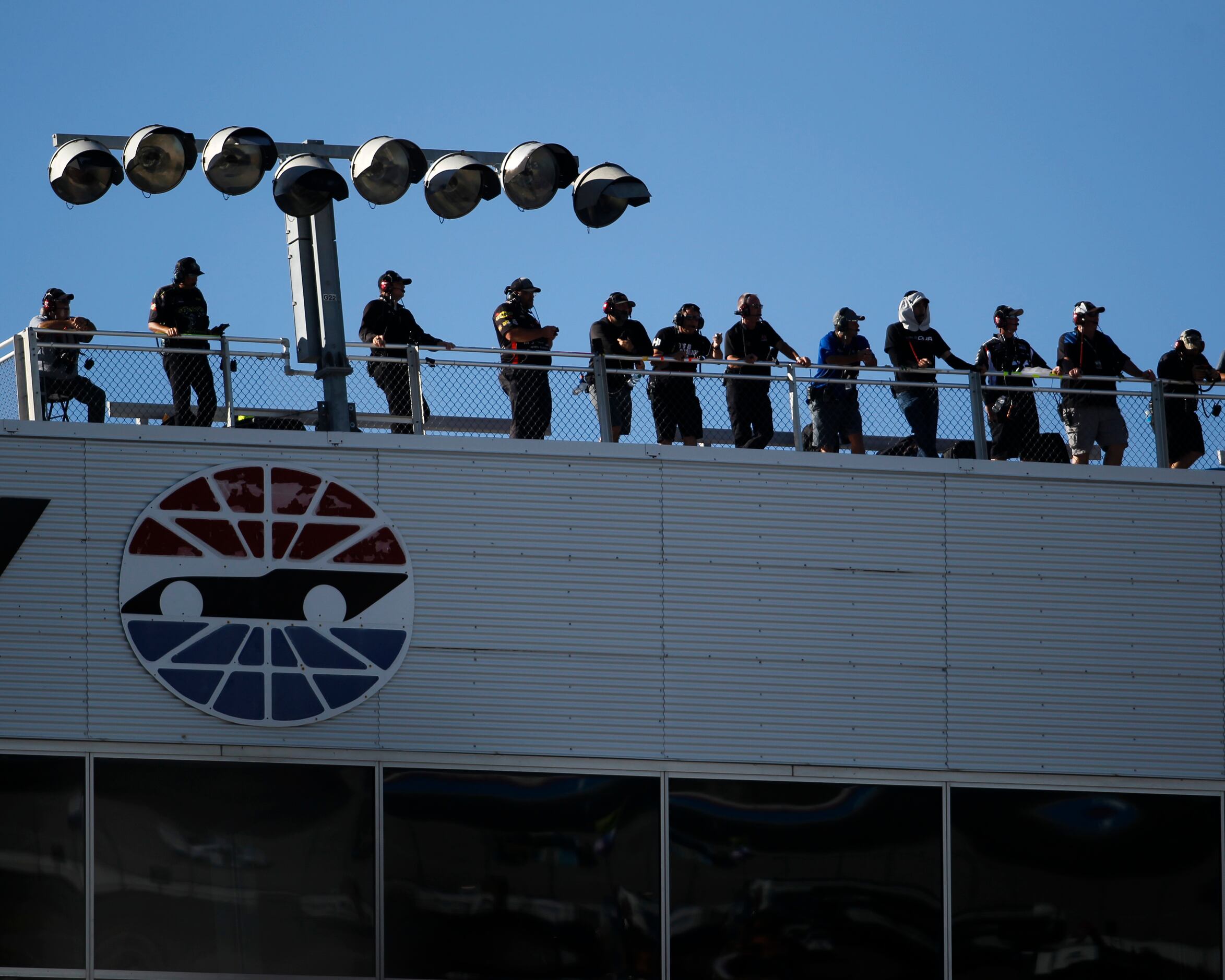 Race spectators look on with a birds eye view form an upper platform. The NASCAR Xfinity...
