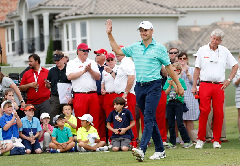 Jordan Spieth waves to the crowd as he is introduced  during a youth golf clinic at TPC Four...