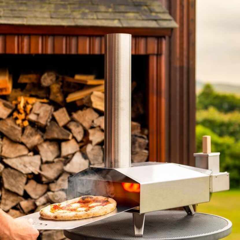 The Ooni Wood Fired Pizza Oven, $275, can be used outdoors on a tabletop.